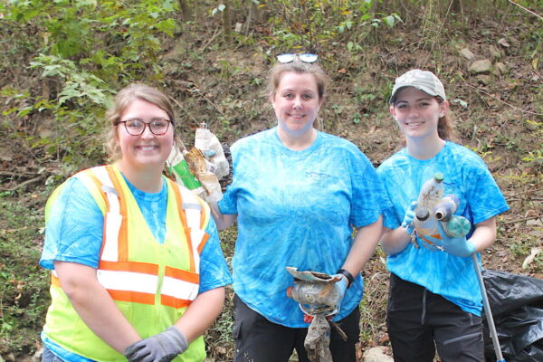 L to R: Natalie McEver, MWA Supervisor of Environmental Compliance, helps organize the annual Ocmulgee Alive! river cleanup. Among the volunteers last year were teacher Candace Bridges and student Zoe Boychuk from Stratford Academy.