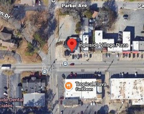A satellite map displays Ingleside Village Pizza and Tropical Flava Caribbean restaurant at a street intersection, surrounded by parking lots, various buildings, and several vehicles in the vicinity.
